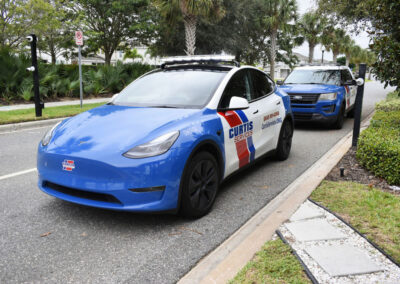 Two Curtis Security Patrol Cars parked on a street