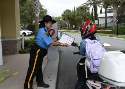 A Curtis Security Officer giving directions to a motorcyclist